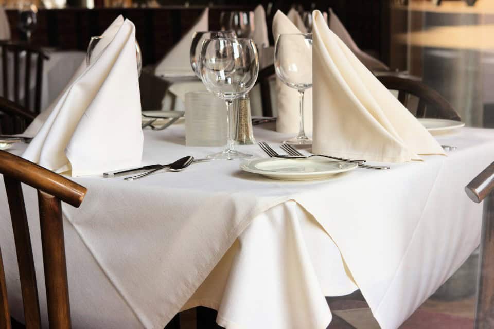 Freshly laundered linens in a hospitality setting, representing customer experience and cleanliness for businesses in Chicago.