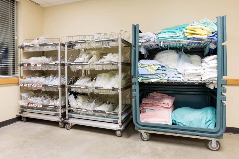 Clean medical linens on carts in a clinic—highlighting the need for professional healthcare laundry services in Chicago as provided by Drop & Dash Laundry Service.